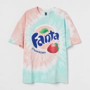 pink and turquoise green tie dye t-shirt with Fanta logo and strawberry logo
